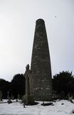 SX02685-02687 Glendalough Round Tower in snow.jpg